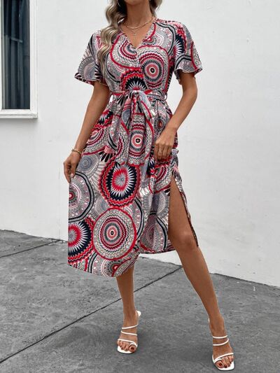 Load image into Gallery viewer, Slit Tied Printed Surplice Dress
